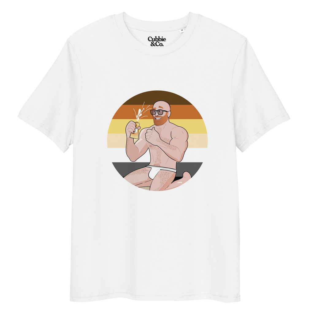 White t-shirt featuring Aaron the beach bear posing in front of a Bear Pride Flag as suncream spurts over his tight budgie smugglers