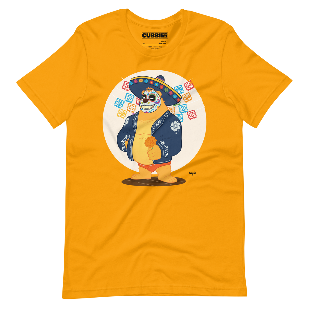 Gold yellow t-shirt featuring a cartoon LGBTQ+ bear character celebrating Day of the Dead, wearing a sombrero and traditional Mexican clothing