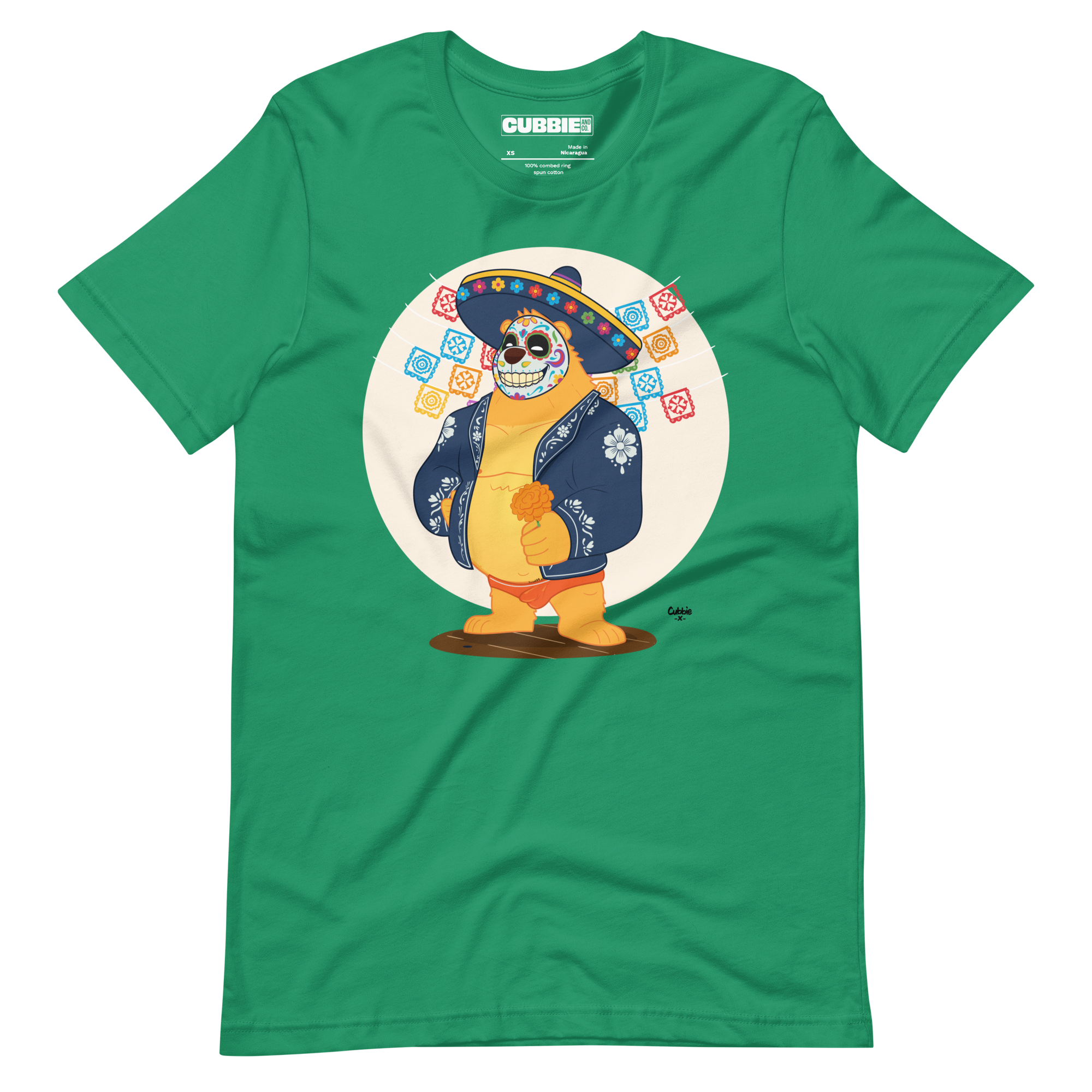 Vibrant green t-shirt featuring a cartoon LGBTQ+ bear character celebrating Day of the Dead, wearing a sombrero and traditional Mexican clothing