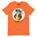 Orange t-shirt featuring a cartoon LGBTQ+ bear character celebrating Day of the Dead, wearing a sombrero and traditional Mexican clothing