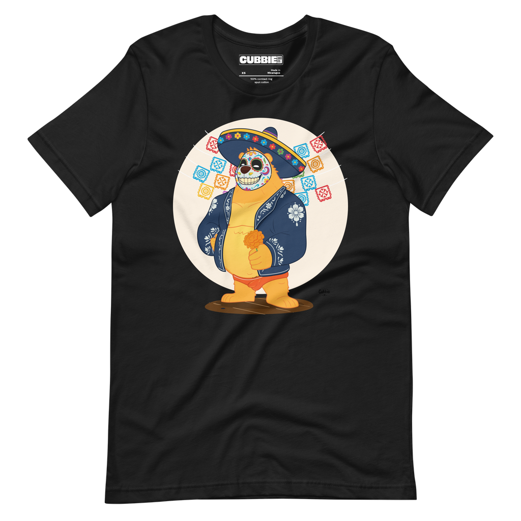 Faded black t-shirt featuring a cartoon LGBTQ+ bear character celebrating Day of the Dead, wearing a sombrero and traditional Mexican clothing