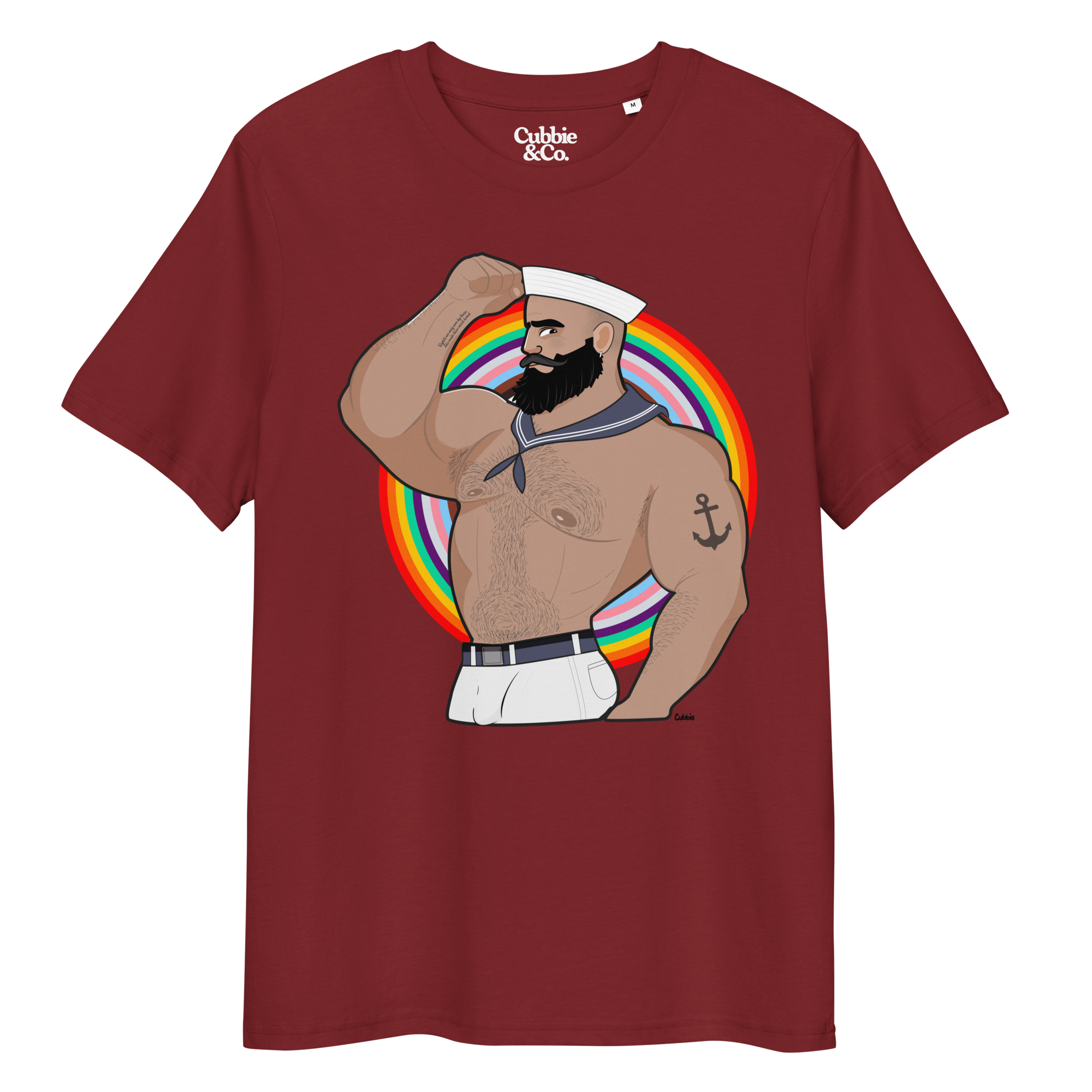 Burgundy t-shirt featuring Kitt the sailor shirtless with white sailor hat and pants, saluting and flexing, with anchor tattoo in front of a Pride rainbow