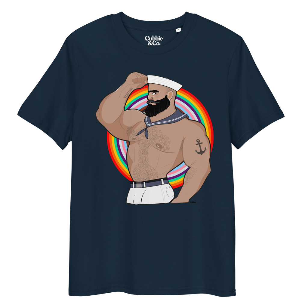 French navy t-shirt featuring Kitt the sailor shirtless with white sailor hat and pants, saluting and flexing, with anchor tattoo in front of a Pride rainbow