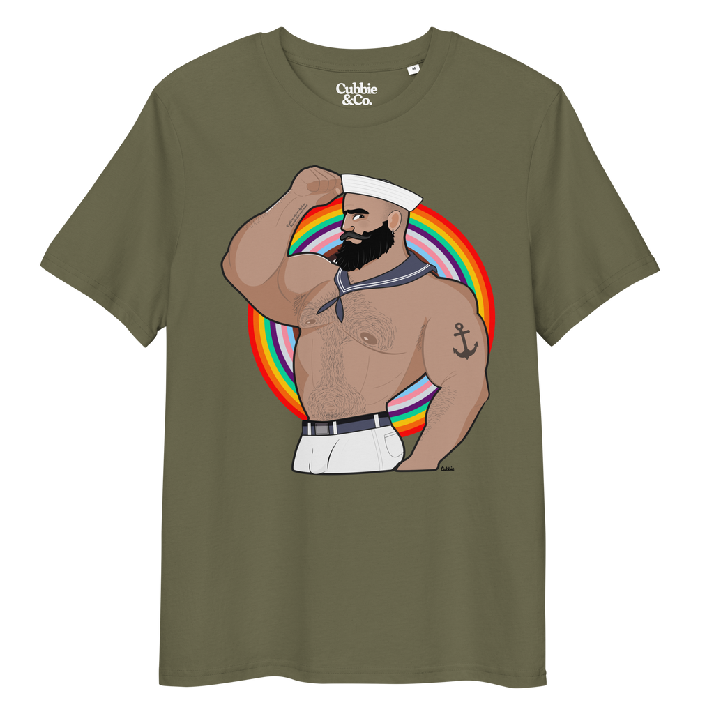 Khaki t-shirt featuring Kitt the sailor shirtless with white sailor hat and pants, saluting and flexing, with anchor tattoo in front of a Pride rainbow