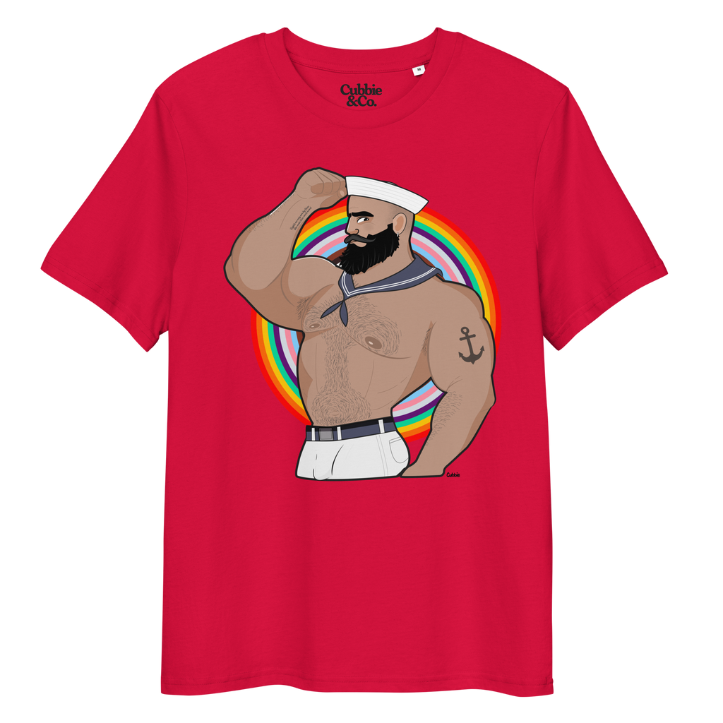 Red t-shirt featuring Kitt the sailor shirtless with white sailor hat and pants, saluting and flexing, with anchor tattoo in front of a Pride rainbow